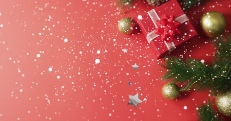 Image of christmas decorations over snow falling. Christmas, celebration and digital interface concept digitally generated image.の写真素材