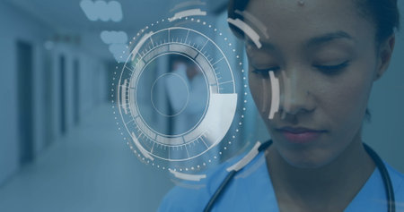 Image of data processing and scope scanning over biracial female doctor in hospital. Medicine,...