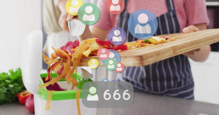 Chopping vegetables, social media interaction image over kitchen scene. Cooking, technology, screen, culinary, ingredients, food preparationの写真素材