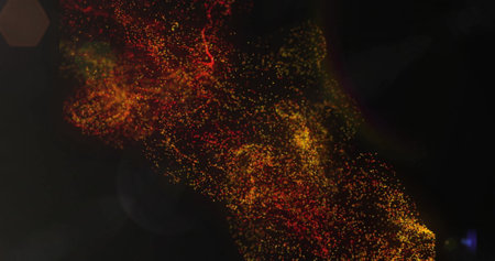 Image of orange shapes and light spots on black background. Abstraction and digital interface...