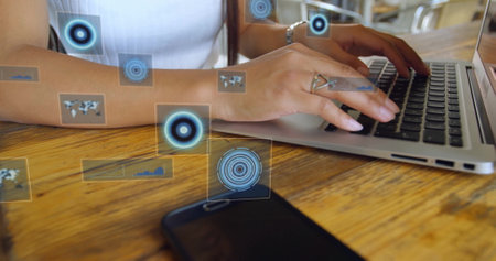 Image of data processing with scope scanning over biracial businesswoman using laptop. Global...