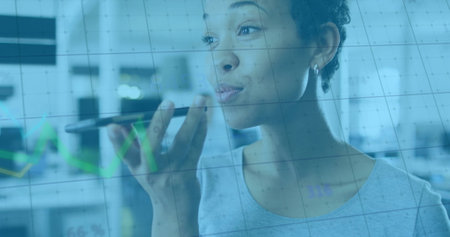 Image of financial data processing over biracial businesswoman using smartphone. Global business,...