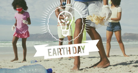 Earth Day text and light bulb image over people cleaning beach. Environment, conservation, sustainability, cleanup, pollution, recyclingの写真素材