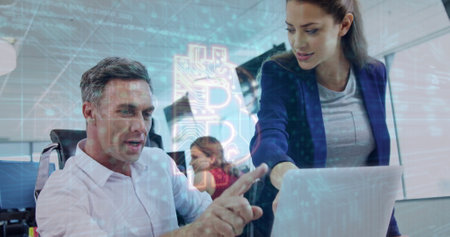 Discussing work at desk, business people with cryptocurrency image over office background. teamwork,...