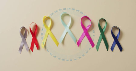 Colorful awareness ribbons with circular data image over beige background. infographic, health, cause, support, charity, informationの写真素材