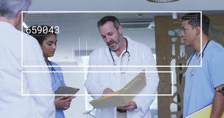 Image of data processing over diverse doctors talking. Global medicine and digital interface concept digitally generated image.の写真素材