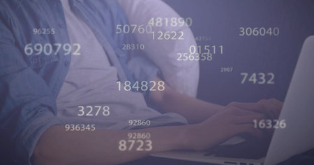 Image of data processing over caucasian man using laptop. Technology and digital interface concept digitally generated image.の写真素材