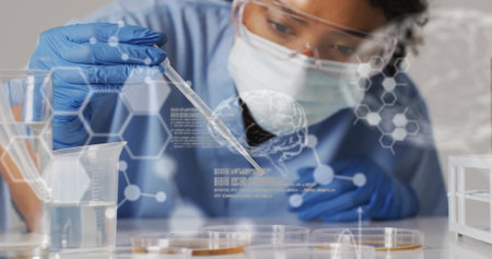 Image of science data processing over biracial female scientist doing experiment. Medicine,...
