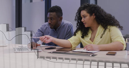 Image of financial data processing over diverse colleagues discussing work in office. Global...