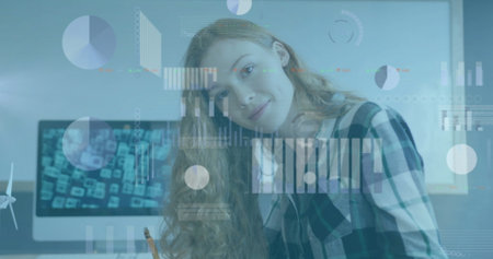 Image of graphs and charts processing data over caucasian casual businesswoman smiling at office....