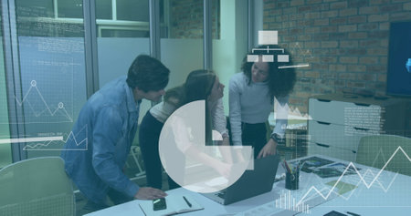 Image of media icons processing data over diverse colleagues using laptop at casual office. Business, connection, office, teamwork, digital interface and communication, digitally generated image.の写真素材