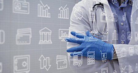 Image of business icons over biracial female doctor with medical gloves. Medicine and digital...