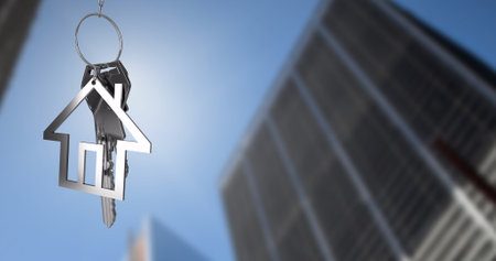 Image of key and house over cityscape. Business, architecture and digital interface concept...