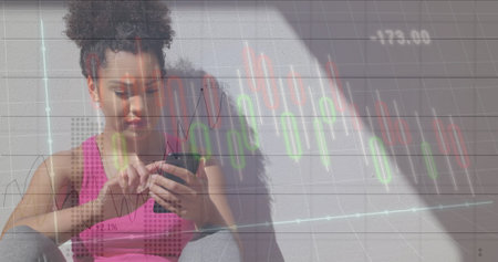 Image of financial data processing over biracial woman using phone during exercise. Global finance,...
