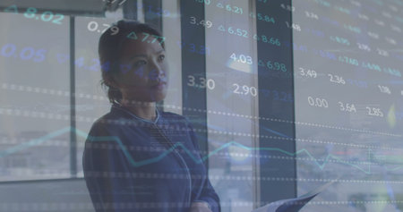Image of financial data processing over asian businesswoman in office. Global finance, business,...