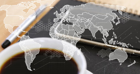 Image of world map over laptop and cup of coffee on desk. Global finance, business, connections,...