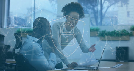 Image of network of connections with padlock over diverse businesspeople in office. Global cyber...
