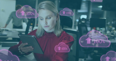 Image of clouds with percents over caucasian businesswoman using tablet in office. Global business...