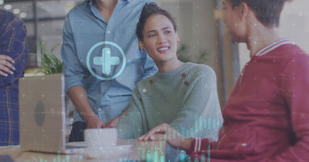 Image of financial data processing over diverse colleagues having meeting in office. Global...