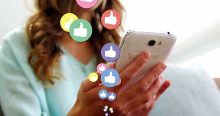 Image of like icons over biracial woman using smartphone. Social media, communication and digital...