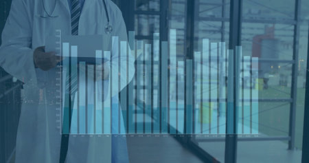 Image of financial data processing over caucasian male doctor in hospital. Global medicine,...