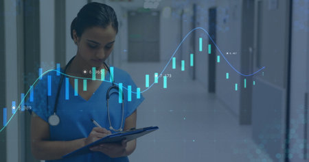 Image of diagrams and data processing over biracial female doctor writing on clipboard. Global...