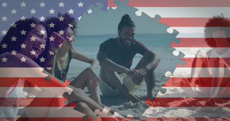 Image of flag of usa over diverse people talking on beach. American diversity, patriotism and...