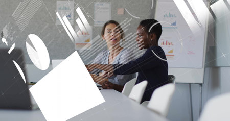 Image of financial data processing over diverse colleagues discussing work in office. Global...