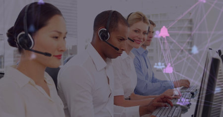 Image of network of connections with icons over diverse colleagues using phone headsets. Global...