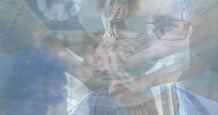 Group of diverse hands joining together, symbolizing unity and teamwork. Collaboration, community,...