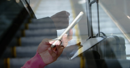 Business professional using tablet and smartphone while commuting. technology, multitasking,...