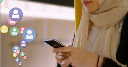 Woman using smartphone, engaging with social media icons, staying connected online. Technology,...