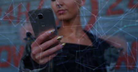 Woman using smartphone with digital interface overlay, exploring virtual connections. Technology,...