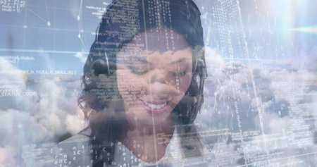 Image of businesswoman talking on phone headset with data processing against sky with clouds. digital interface global connection and communication concept digitally generated image.の写真素材