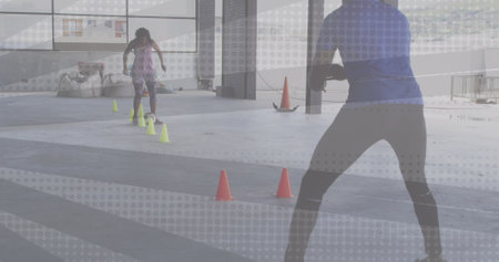 Image of woman playing football being coached by a man. Digital interface global sport and...