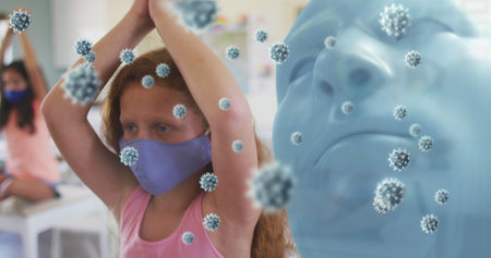 Image of model head with covid 19 cells and schoolgirl in classroom wearing face masks. healthcare...