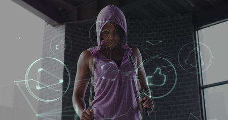Image of technological icons over woman exercising in a building. Digital interface global sport and performance concept digitally generated image.の写真素材