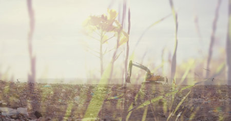 Summer grass over digger in rubbish disposal site. environment, global warming and climate change concept digitally generated image.の写真素材