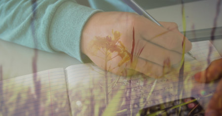 Close-up of hand writing calculations in notebook, focusing on finance work. accounting, budgeting, analytics, pen, paper, economyの写真素材