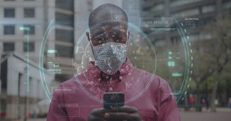 Scope scanning over covid-19 cell against african american man wearing face mask using smartphone. global networking and covid-19 pandemic conceptの写真素材