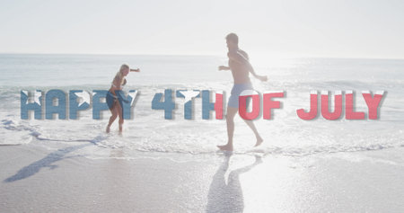 Image of happy 4th of july text with american flag pattern over couple splashing in sea. usa, patriotism and democracy concept digitally generated image.の写真素材
