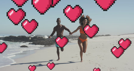 Image of heart digital icons over couple running and holding hands on beach. digital interface,...