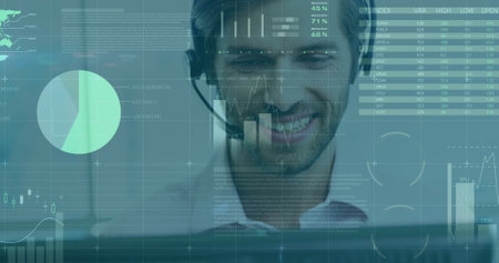 Smiling man with headset analyzing digital data on computer screen at office. Technology, analysis,...