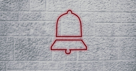 Red bell outline on textured stone wall, creating minimalist urban art. mural, abstract, contemporary, street, architecture, designの写真素材