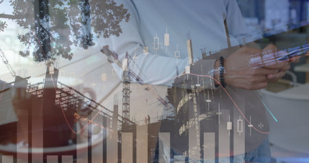 Image of statistics and data processing over construction site and businessman using smartphone. global business, data processing and technology concept digitally generated image.の写真素材