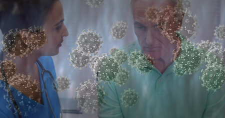 Virus cells floating around while female health worker talking to sick senior man. Healthcare, pandemic, consultation, infection, medical worker, elderly careの写真素材
