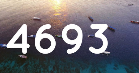 Digital image of the number in bold white text over a scenic sunset by the water. the composition blends technology with nature, symbolizing digital engagementの写真素材