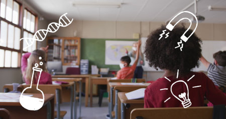 Image of school items icons moving over schoolchildren wearing face masks. education, development and learning concept digitally generated image.の写真素材