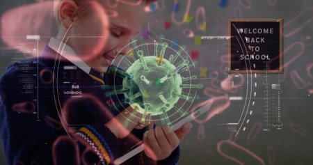 Image of Covid 19 coronavirus cell spinning, scope scanning with Welcome Back To School over schoolboy with tablet. Education back to school coronavirus pandemic concept digitally generated image.の写真素材