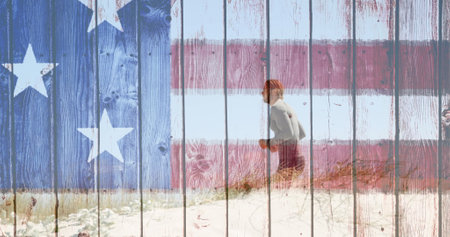 Digital composite of man running on beach on bright day against animated wood backgroundの写真素材